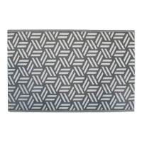 Mata ogrodowa w odcieniach szarości z geometrycznym wzorem.