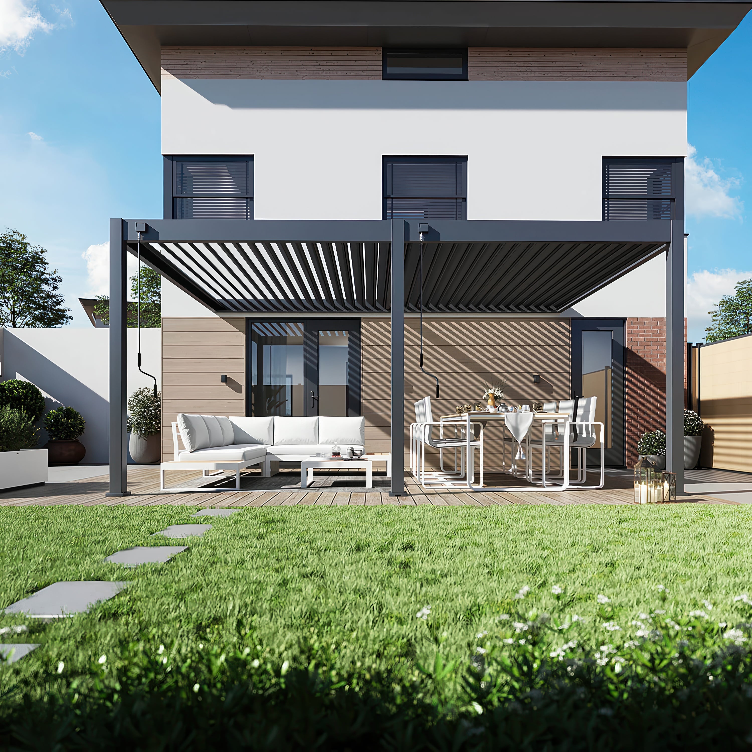 Pergola tarasowa DELUXE WALL 3.6x5.3 w aranżacji przed domem, widziana z frontu.