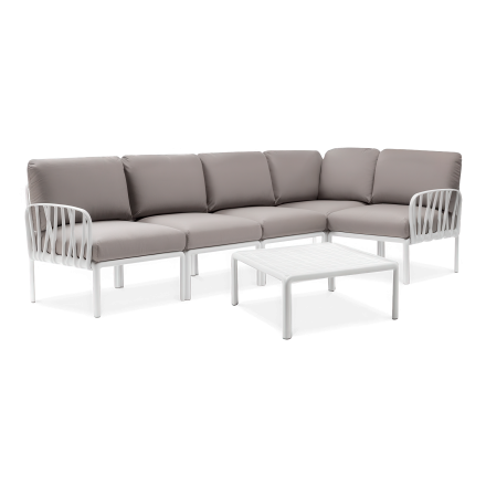 biały modułowy narożnik ogrodowy z poduchami i stołem w zestawie
