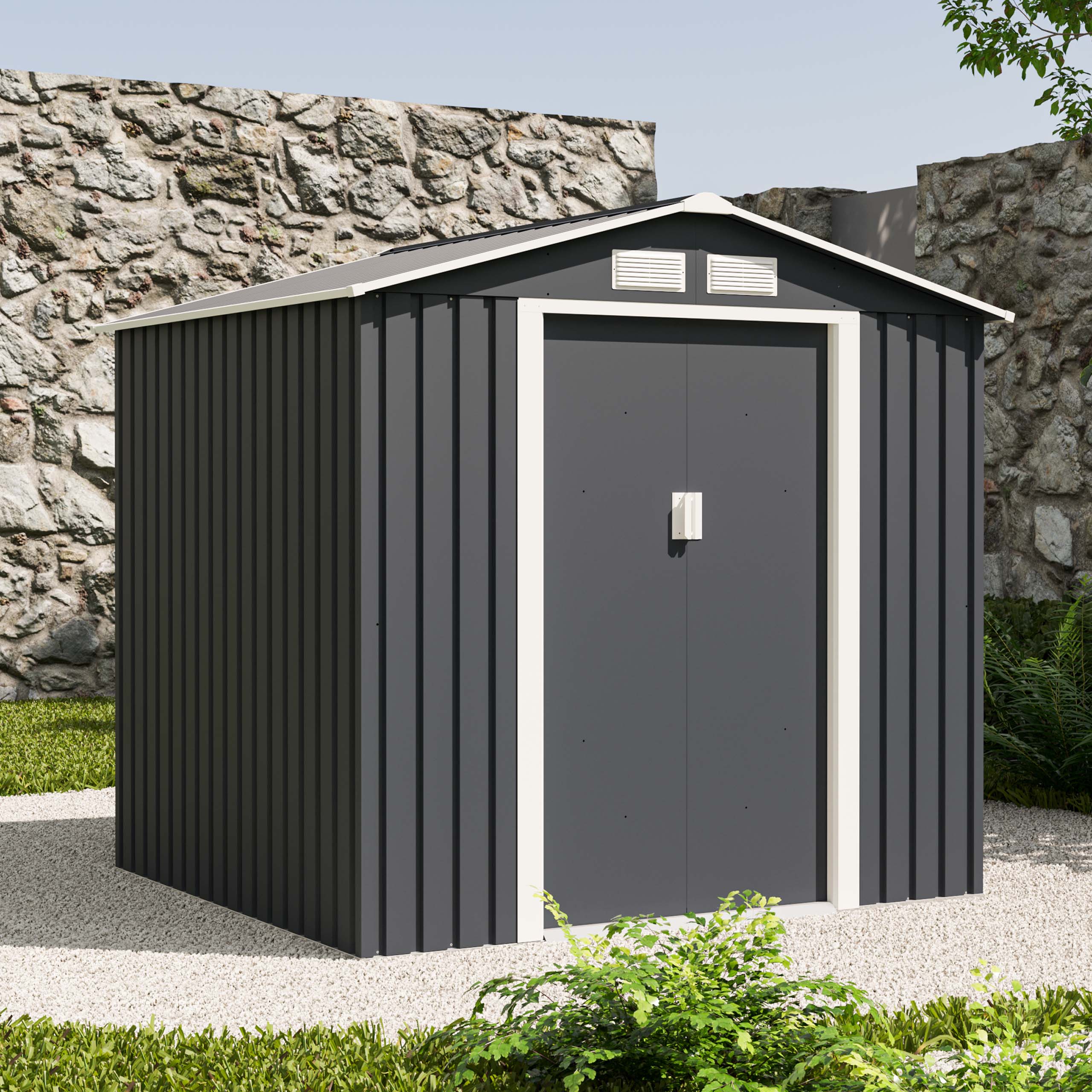 Metalowy domek ogrodowy w kolorze antracytowym na podłożu z kamieni i roślin w ogrodzie aranżacja