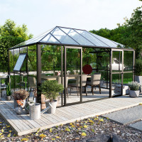 Oranzeria zimowa BROADWAY Black 436x295cm Solid PC+ Glass - Gutroof, na ogrodzie, czarna, szklany dach, wśród kwiatów i roślin