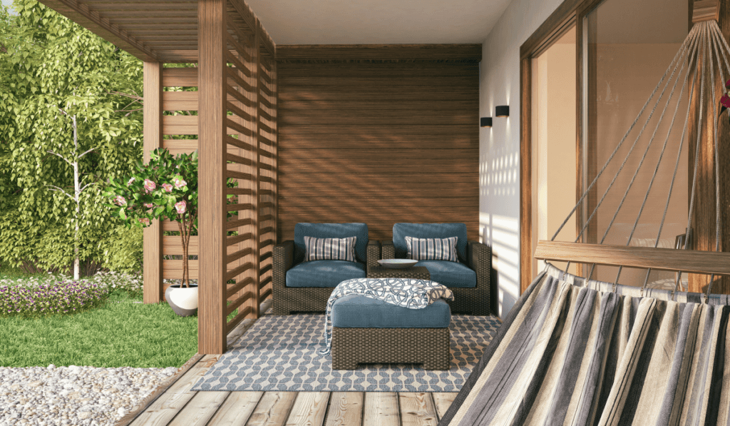 Drewniany taraz wraz z meblami oraz delikatnymi dodatkami w postaci pufy oraz hamaka