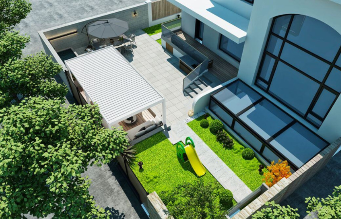 biała pergola bioklimatyczna ustawiona w ogrodzie i wydzielająca strefę wypoczynkową za domem 